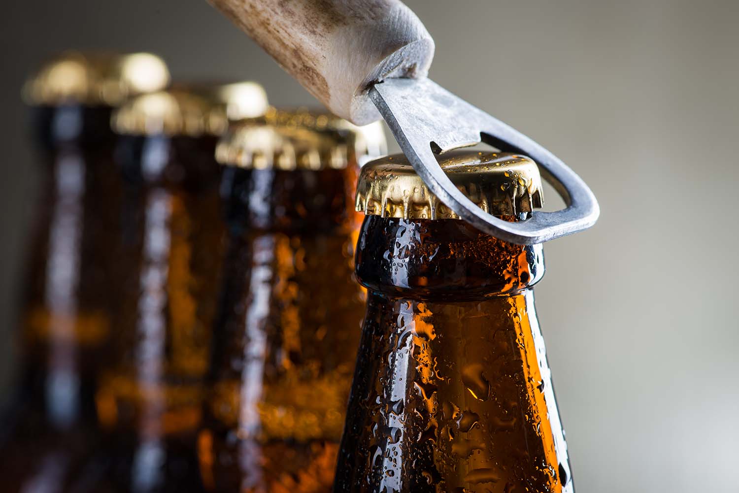 brown-ice-cold-beer-bottles-with-old-opener-eagle-distributing